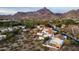 Scenic aerial view of a residential area with mountain backdrop and homes with red-tiled roofs at 6188 N 29Th Pl, Phoenix, AZ 85016