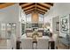 A dining room with an open floor plan and an eye-catching wooden vaulted ceiling at 6188 N 29Th Pl, Phoenix, AZ 85016