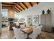 Bright dining area with a wooden vaulted ceiling open to the living room at 6188 N 29Th Pl, Phoenix, AZ 85016