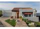 Charming single-story home featuring a red tile roof, decorative plants and a walkway to the front door at 6188 N 29Th Pl, Phoenix, AZ 85016