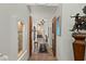 Inviting hallway with tile floors, recessed lighting, and decorative niches, leading to various rooms at 6188 N 29Th Pl, Phoenix, AZ 85016