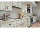 Modern kitchen featuring stainless steel appliances, white cabinets, and light countertops at 6188 N 29Th Pl, Phoenix, AZ 85016