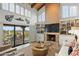 Living room with a fireplace, built-in shelves, a sofa, and sliding glass doors to the patio at 6188 N 29Th Pl, Phoenix, AZ 85016