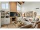 Bright living area featuring a fireplace, built-in shelves, a sofa, and desert-themed decor at 6188 N 29Th Pl, Phoenix, AZ 85016