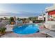 Inviting pool with decorative water feature, stone patio, and serene mountain views at dusk at 6188 N 29Th Pl, Phoenix, AZ 85016