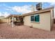 Backyard featuring desert landscaping and a covered patio with comfortable outdoor seating at 6335 E Brown Rd # 1081, Mesa, AZ 85205