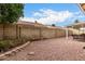 Backyard with a stone wall, desert landscaping, and a covered patio with outdoor seating at 6335 E Brown Rd # 1081, Mesa, AZ 85205