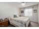 Cozy bedroom featuring neutral walls, a patterned quilt, and a ceiling fan for added comfort at 6335 E Brown Rd # 1081, Mesa, AZ 85205