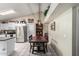 Bright kitchen featuring stainless steel appliances and an adjacent dining area with decorative accents at 6335 E Brown Rd # 1081, Mesa, AZ 85205