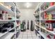 Well-organized pantry with ample shelving for storage and tile flooring, providing functional space at 6335 E Brown Rd # 1081, Mesa, AZ 85205