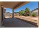 Expansive backyard featuring a covered patio and mature desert plants at 6350 W Hess St, Phoenix, AZ 85043