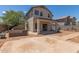 Backyard view showcasing the covered patio and desert landscaping at 6350 W Hess St, Phoenix, AZ 85043