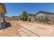 Wide angle of large backyard area with desert landscaping and block wall at 6350 W Hess St, Phoenix, AZ 85043