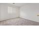 Empty bedroom with carpet, white walls, and a window creating a blank canvas for personalization at 6350 W Hess St, Phoenix, AZ 85043