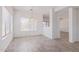 Bright dining room with wood-look tile flooring and modern chandelier at 6350 W Hess St, Phoenix, AZ 85043