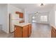 View of the kitchen and a view to the bright living area with great natural light and outside access at 6350 W Hess St, Phoenix, AZ 85043