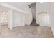 Open living room with staircase, white walls and wood look flooring at 6350 W Hess St, Phoenix, AZ 85043