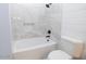 Close-up of a bathroom shower-tub combination with white marble-style tile at 6454 E University Dr # 5, Mesa, AZ 85205