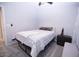 Bedroom featuring neutral carpet and walls, a ceiling fan and an abstract painting at 6454 E University Dr # 5, Mesa, AZ 85205