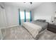 Bedroom featuring neutral carpet and walls, double windows and a sliding closet door at 6454 E University Dr # 5, Mesa, AZ 85205