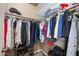 Organized closet with hanging rods and shoe racks providing ample storage for clothing and accessories at 650 N Hawes Rd # 3607, Mesa, AZ 85207