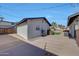 Backyard featuring a detached garage, grill, lush green grass and sparkling pool at 6634 N 16Th Dr, Phoenix, AZ 85015