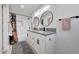 Updated bathroom with double vanity, modern fixtures, subway tile shower, and stylish accents at 6634 N 16Th Dr, Phoenix, AZ 85015