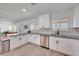 Modern kitchen featuring white cabinets, stainless appliances, and stone countertops at 6634 N 16Th Dr, Phoenix, AZ 85015