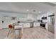 Modern kitchen with stainless steel appliances, stone countertops, and sleek white cabinetry at 6634 N 16Th Dr, Phoenix, AZ 85015