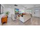 Bright living room featuring fireplace, hardwood floors, neutral paint, and large windows at 6634 N 16Th Dr, Phoenix, AZ 85015