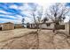 Large backyard with mature trees and storage shed, perfect for outdoor activities and storage at 6720 W Medlock Dr, Glendale, AZ 85303