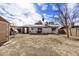 The expansive backyard features a covered patio, storage shed, and mature trees for a private retreat at 6720 W Medlock Dr, Glendale, AZ 85303