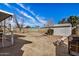 Large backyard featuring a detached storage shed and mature trees at 6720 W Medlock Dr, Glendale, AZ 85303