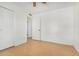 A clean bedroom with neutral tile floors and a ceiling fan at 6720 W Medlock Dr, Glendale, AZ 85303