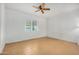 An airy bedroom with a large window and tile flooring at 6720 W Medlock Dr, Glendale, AZ 85303