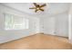 Bright, empty bedroom featuring tiled floor, neutral walls, and a ceiling fan at 6720 W Medlock Dr, Glendale, AZ 85303