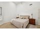 Bright bedroom featuring neutral tones, carpeted floor, ceiling fan and vaulted ceilings at 698 W Merrill Ave, Gilbert, AZ 85233