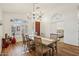 Dining room featuring wood flooring and direct access to the bedroom at 698 W Merrill Ave, Gilbert, AZ 85233