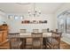 Formal dining room with wood floors, chandelier, and space for six, perfect for entertaining at 698 W Merrill Ave, Gilbert, AZ 85233