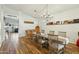 Formal dining room with wood floors, chandelier, and space for six, perfect for entertaining at 698 W Merrill Ave, Gilbert, AZ 85233