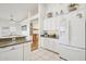 Bright kitchen featuring white cabinetry, neutral countertops, and lots of open space at 698 W Merrill Ave, Gilbert, AZ 85233