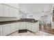 Bright kitchen featuring white cabinetry, neutral countertops, and an open layout at 698 W Merrill Ave, Gilbert, AZ 85233