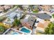 Aerial view of home with in-ground pool, solar panels, mature landscaping, and neighboring houses at 713 N Banning Cir, Mesa, AZ 85205