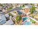 Aerial view of a home showcasing a pool, solar panels, and a well-maintained yard at 713 N Banning Cir, Mesa, AZ 85205