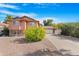 Charming two-story home featuring a well-manicured front yard and attached garage at 713 N Banning Cir, Mesa, AZ 85205