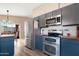 Modern kitchen featuring stainless steel appliances and stylish cabinetry at 713 N Banning Cir, Mesa, AZ 85205