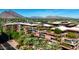 Aerial view of residences with lush garden rooftops and mountain backdrop at 7147 E Rancho Vista Dr # 3010, Scottsdale, AZ 85251