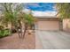 Charming single-story home with a well-manicured front yard and a two-car garage at 7322 S Sunset Way, Buckeye, AZ 85326