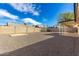 Spacious backyard featuring gravel, a block wall, and a covered patio providing ample outdoor space at 7326 W Georgia Ave, Glendale, AZ 85303