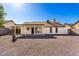 Well-maintained backyard with gravel and a covered patio, perfect for outdoor relaxation and entertainment at 7326 W Georgia Ave, Glendale, AZ 85303